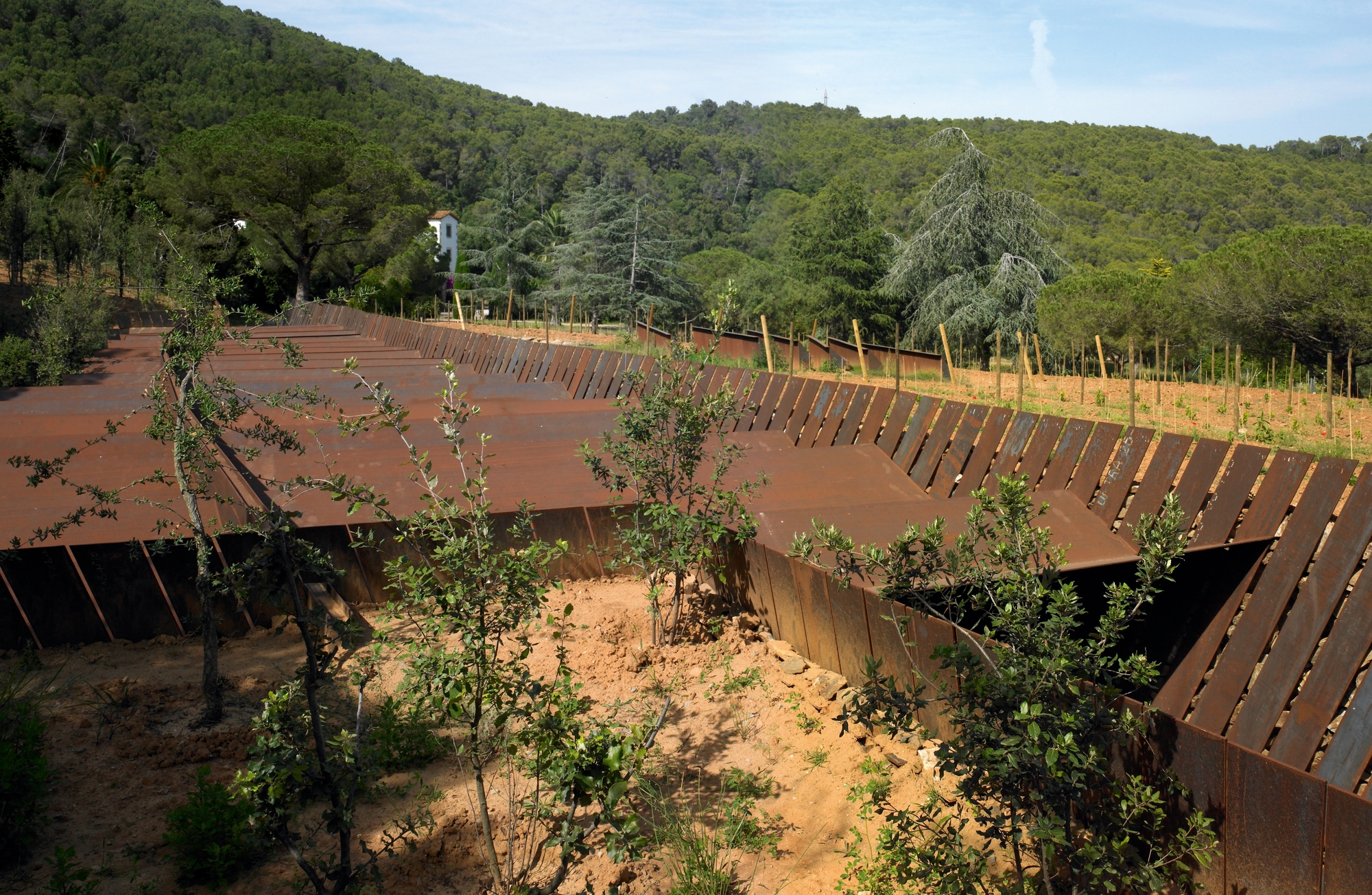 The winery sits in the landscape like a giant piece of Cor-ten origami