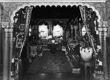 A cluttered and gloomy 19th-century interior of the sort to which modern architecture was a more or less inevitable purgative reaction