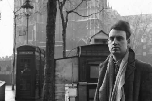 Ian Nairn outside Westminster Abbey, London. Photo: Architectural Press Archive / RIBA Library Photographs Collection