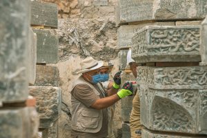 Members of the State Board of Antiquities and Heritage of Iraq (SBAH) documenting the archaeological remains