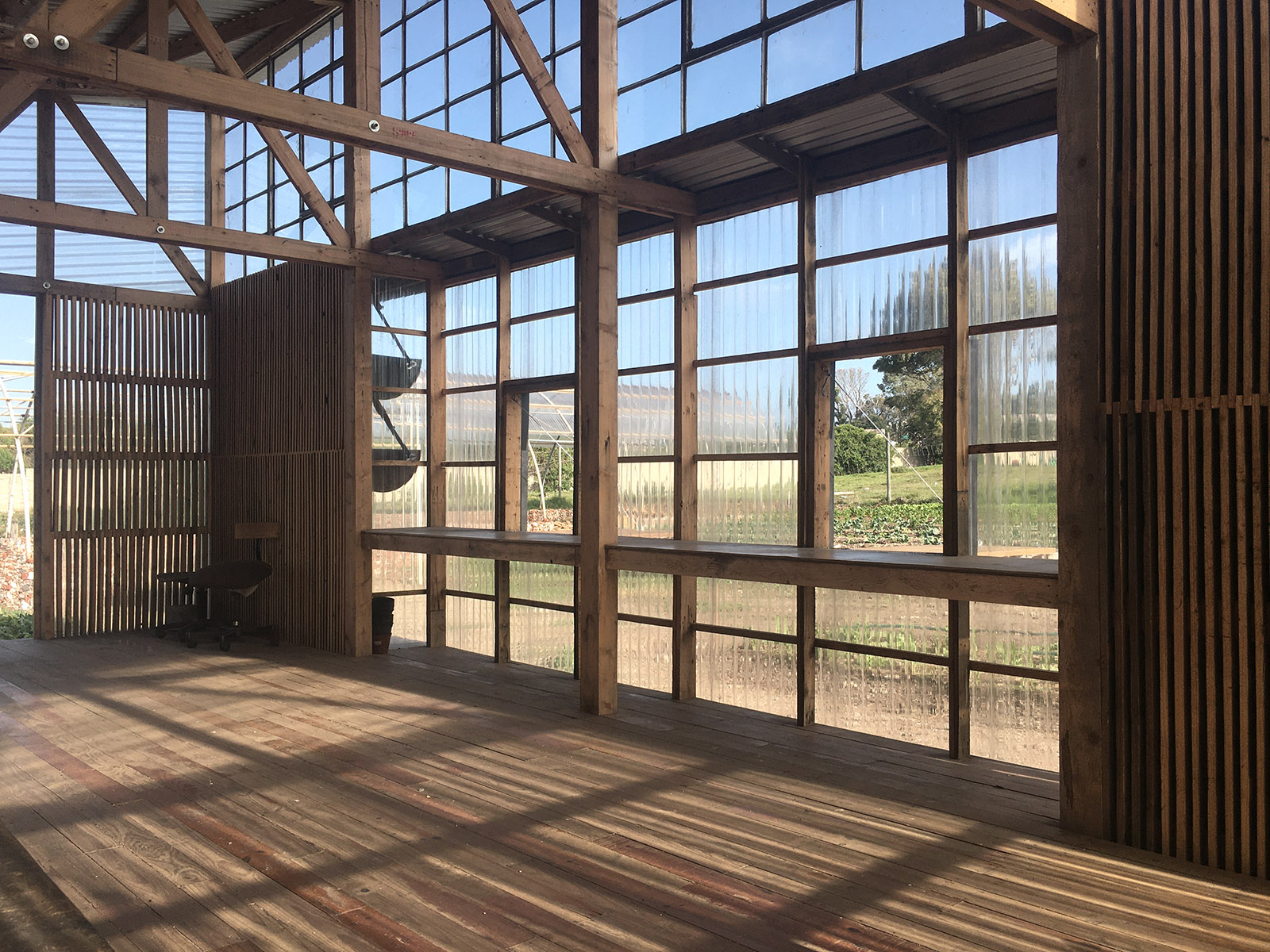 The shop and café of the Lim'uphile Co-op are constructed from timber pallets, polycarbonate and carpet tiles