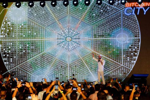 2H76YF9 El Salvador's president Nayib Bukele speaks at the closing party of the Bitcoin Week where he announced the plan to build the first Bitcoin City in the world, in Teotepeque, El Salvador November 20, 2021. REUTERS/Jose Cabezas