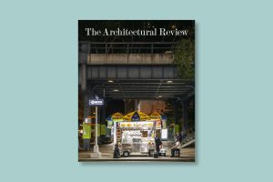 Cover of the July/August 2024 issue of the Architectural Review on a blue background. the cover depicts a hotdog stand at night beneath the High Line in New York