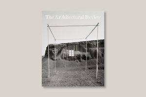 the cover of the December/January edition of the Architectural Review is a photograph by Ettore Sottsass from Spain depicting a landscape with a barebones room