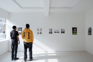 Two members of the Mass Mentorship programme at a group exhibition