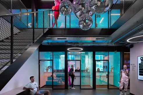 Queer LGBTIA+ clinic Checkpoint Zürich designed by Skop, featuring neon-coloured lighting and disco balls