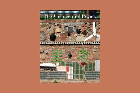 Cover image of The Architectural Review May 2025 Issue on Circularity depicts a wall in China constructed from reused materials including bottles and a ceiling fan