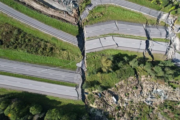 Large damages at E6 near Stenungsund. The road is closed in both directions after persistent rain has caused a large landslide where several cars and a buses went down Landslide on E6 Stenungsund, Sweden - 24 Sep 2023