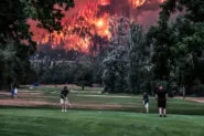 Eagle Creek wildfire burns as golfers play at the Beacon Rock Golf Course in North Bonneville, Washington, U.S. on September 4, 2017.
