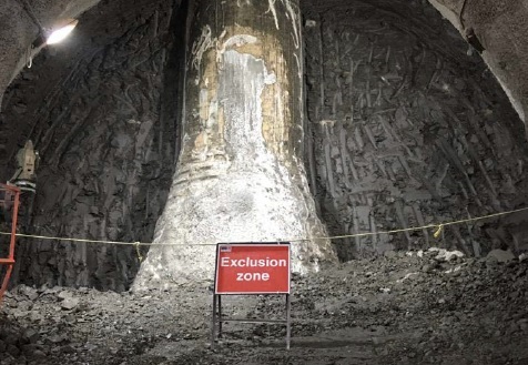 Large skyscraper foundation pile uncovered by Bank Station Northern Line work, in a view from the escavation tunnel.