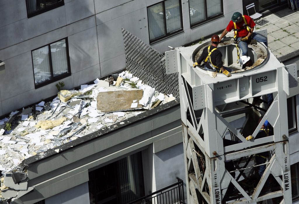 Family of crane collapse victim hold anniversary vigil | Construction News