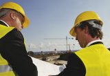 Construction workers in hard hats on site