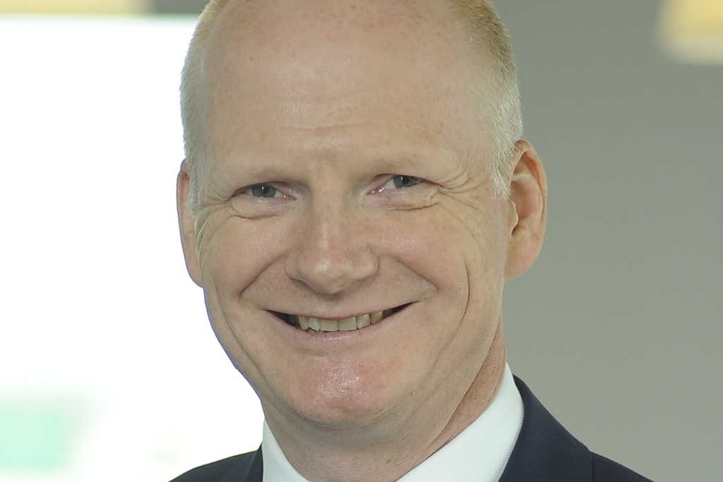 UK profit halves after problem job hit Construction News