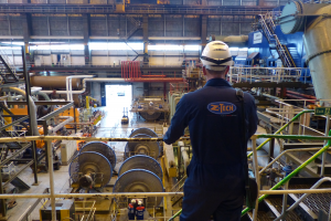 Z-Tech worker looks on at electrical equipment