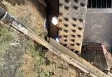 View from below the bridge where a hole has formed